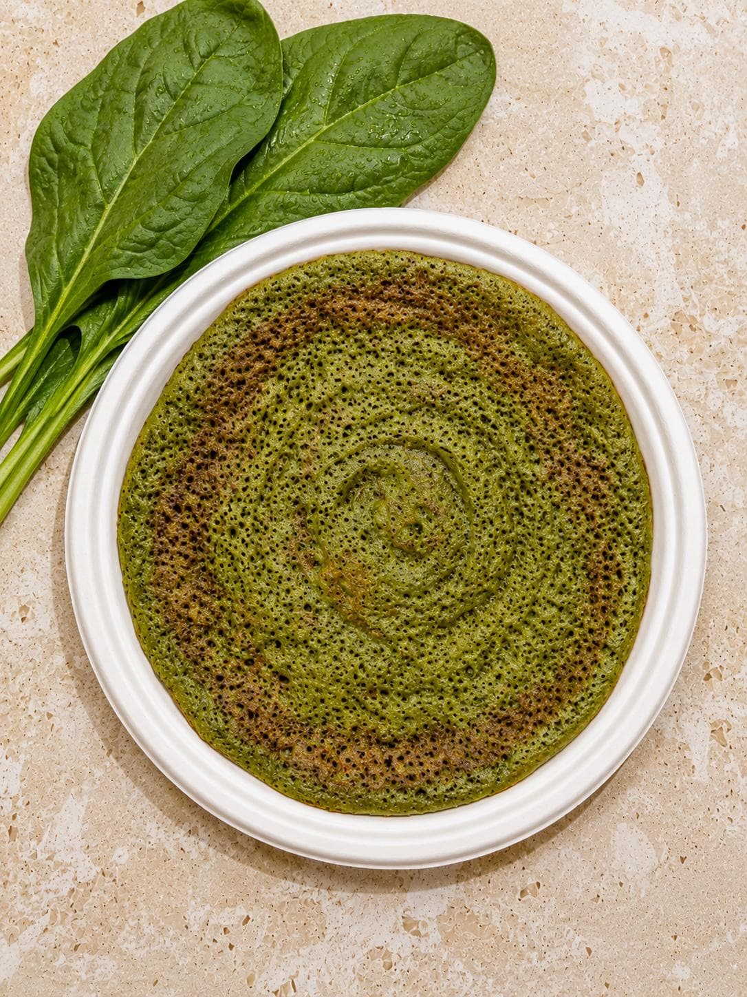 Palak (spinach) dosa with fresh spinach leaves